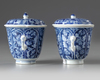 A pair of Chinese blue and white twin-handled chocolate cups and covers