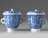 A pair of Chinese blue and white twin-handled chocolate cups and covers