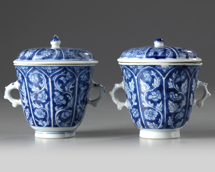 A pair of Chinese blue and white twin-handled chocolate cups and covers