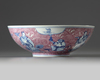 A Chinese puce-enamelled blue and white 'Immortals' bowl