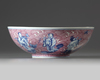 A Chinese puce-enamelled blue and white 'Immortals' bowl