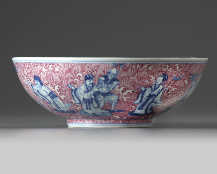 A Chinese puce-enamelled blue and white 'Immortals' bowl