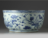 A CHINESE BLUE AND WHITE DUCKS AND LOTUS' BASIN, MING DYNASTY (1368-1644)