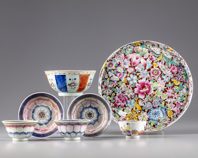 A Chinese famille rose group of three cups, two saucers, a bowl and a dish