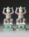 A PAIR OF CHINESE FAMILLE ROSE FOREIGNER CANDLESTICKS, 19TH CENTURY