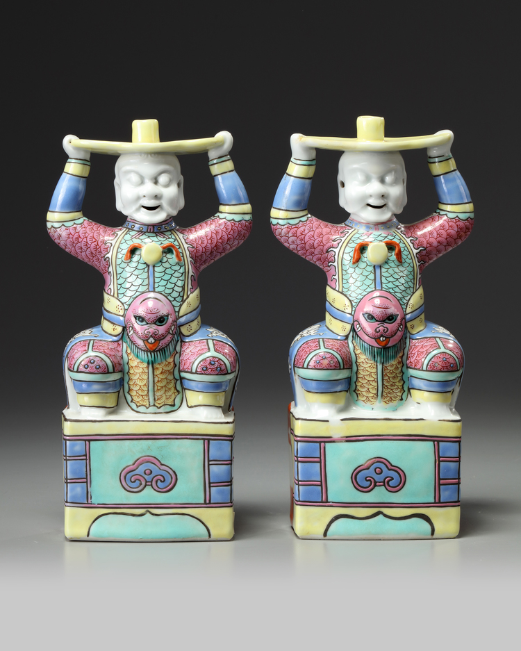 A PAIR OF CHINESE FAMILLE ROSE FOREIGNER CANDLESTICKS, 19TH CENTURY