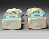 A PAIR OF CHINESE FAMILLE ROSE FOREIGNER CANDLESTICKS, 19TH CENTURY