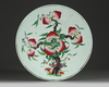A Chinese famille rose 'nine peaches' charger