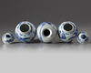 A pair of Chinese blue and white 'ladies' jars and covers and a 'figural' vase