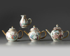 A GROUP OF FOUR CHINESE FAMILLE ROSE AND GILT-DECORATED TEAWARES, QIANLONG PERIOD (1736-1795)