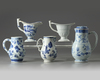 A GROUP OF FIVE CHINESE BLUE AND WHITE AND EN GRISAILLE POURING VESSELS