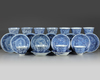 A set and a matched set of Chinese blue and white ‘flower scroll’ cups and saucers