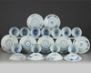 A set and a matched set of Chinese blue and white ‘flower scroll’ cups and saucers