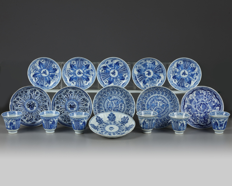 A group of Chinese blue and white cups and saucers