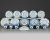 A group of Chinese blue and white cups and saucers