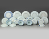 A group of Chinese blue and white 'figural' cups and saucers
