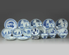 A group of Chinese blue and white 'figural' cups and saucers