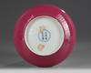 A CHINESE FAMILLE ROSE RUBY-BACK 'BIRD AND FLOWER' DISH