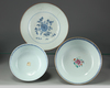 Two Chinese blue and white bowls and a famille rose bowl