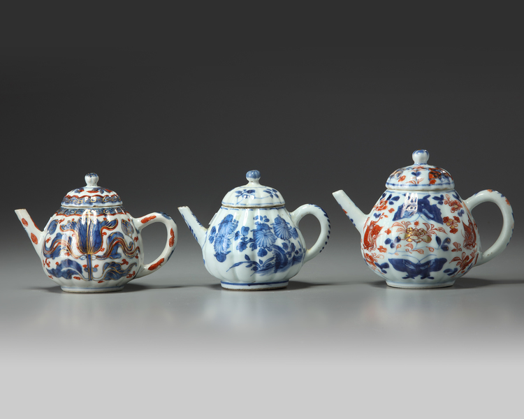 THREE CHINESE MOULDED TEAPOTS AND COVERS, KANGXI PERIOD (1662-1722)