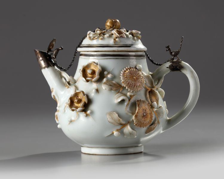 A SILVER MOUNTED CHINESE GILT AND IRON-RED-DECORATED RELIF-MOULDED TEAPOT AND COVER, YONGZHENG PERIOD (1723-1735)
