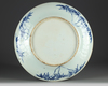 A Large Chinese blue and white 'dragon and flower' charger