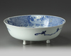 A Chinese blue and white pierced tripod basin