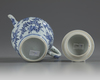 A Chinese blue and white moulded teapot