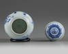 A small Chinese blue and white jar and a cover