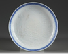 A moulded Chinese blue and white dish