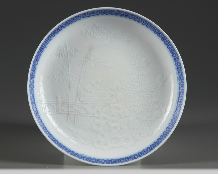 A moulded Chinese blue and white dish