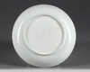 A moulded Chinese blue and white dish