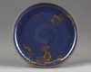 A GILT JAPANESE BLUE GROUND DISH, 17TH CENTURY