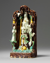 A Chinese green, yellow, and aubergine-glazed grotto