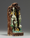 A Chinese green, yellow, and aubergine-glazed grotto