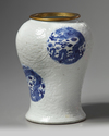 A rare Chinese moulded white-ground blue and white 'dragon' vase