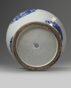 A rare Chinese moulded white-ground blue and white 'dragon' vase