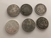 Five Chinese silver coins and a silver Mexican peso