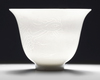 A Chinese white-glazed 'phoenix' cup