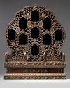 A Chinese hardwood parcel-gilt foliate altar cabinet