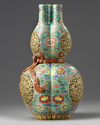 A Chinese famille rose triple gourd vase