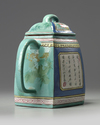 A Chinese famille rose enamelled yixing teapot and cover