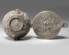 A Tibetan silver tea bowl container and hinged cover