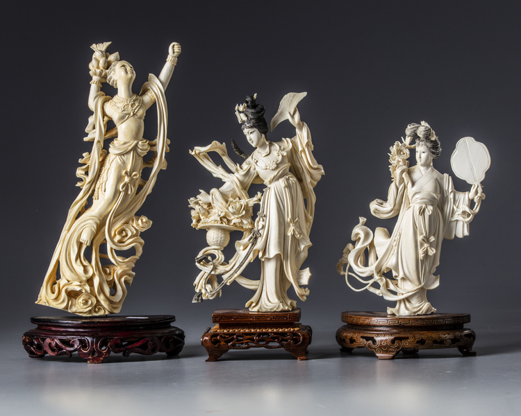 A group of three Chinese carved ivory maidens