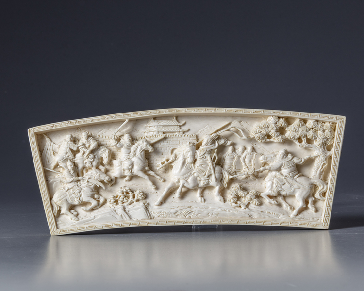 A Chinese ivory plaque depicting a warrior scene