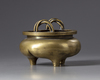 A gilt Chinese bronze tripod