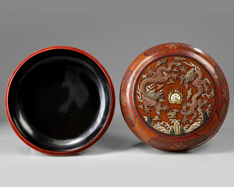 A Chinese tianqi lacquer precious objects-inlaid 'dragon' box and cover