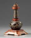 A Chinese imitation bronze and faux-bois decorated stupa
