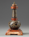 A Chinese imitation bronze and faux-bois decorated stupa