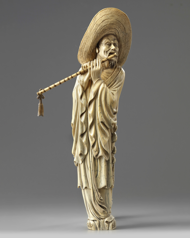 A CHINESE CARVED IVORY MUSICIAN, CHINA, 19TH-20TH CENTURY